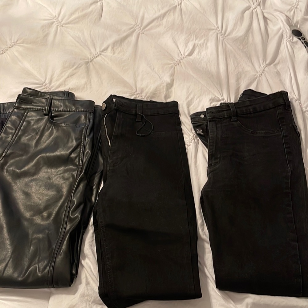 Set of three black pants. On in Faux leather, two skinny jeans in black